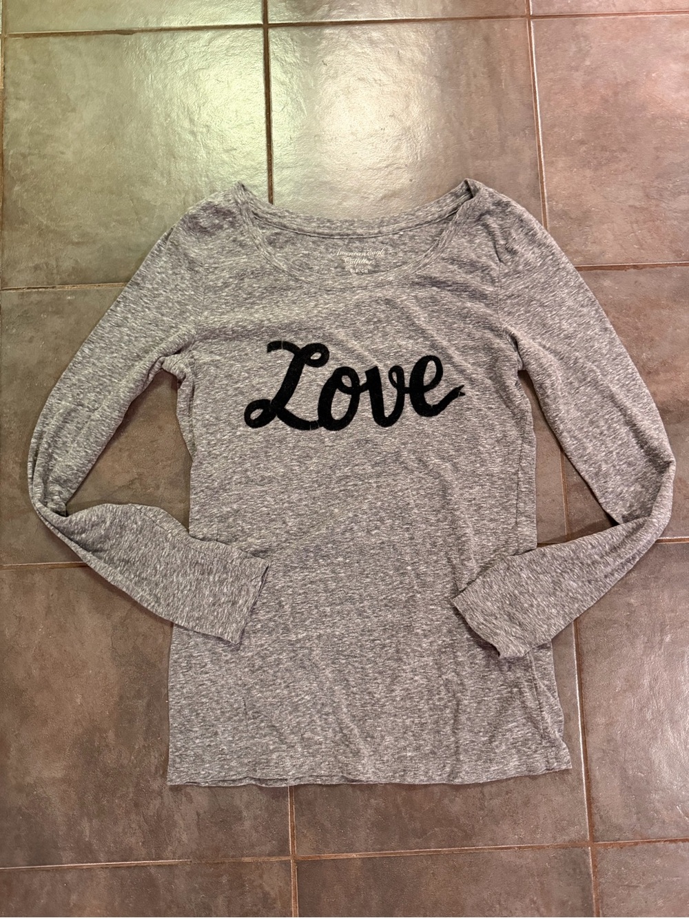 Gray long sleeve American Eagle Outfitters shirt with black cursive 'Love' text